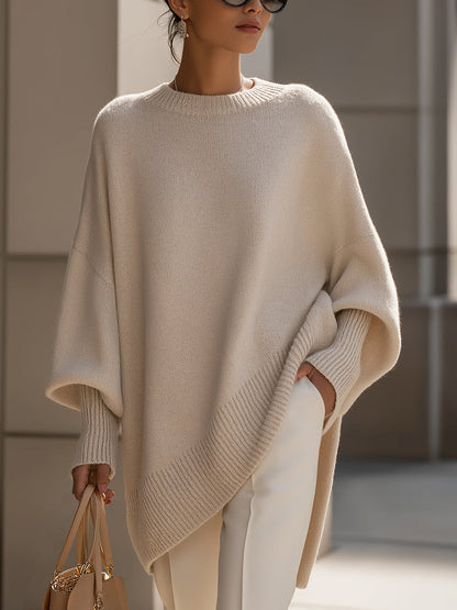 Gebreide oversized trui dames met vleermuismouwen en asymmetrische zoom