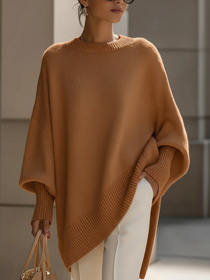 Gebreide oversized trui dames met vleermuismouwen en asymmetrische zoom