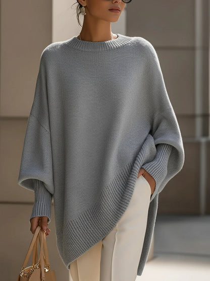 Gebreide oversized trui dames met vleermuismouwen en asymmetrische zoom