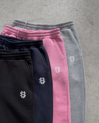 Flared joggingbroek met enkelritsen en elastische tailleband