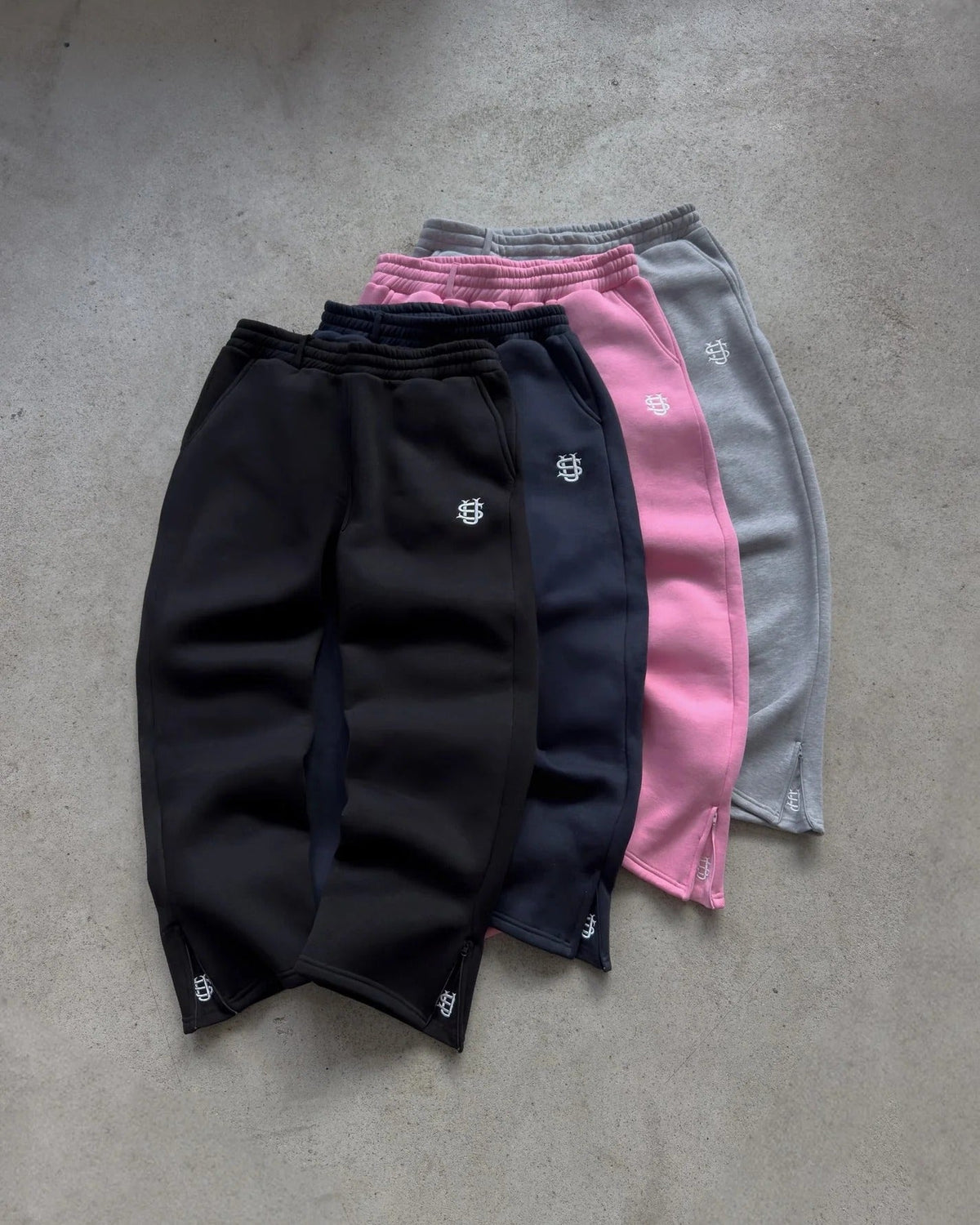 Flared joggingbroek met enkelritsen en elastische tailleband
