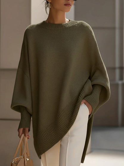 Gebreide oversized trui dames met vleermuismouwen en asymmetrische zoom
