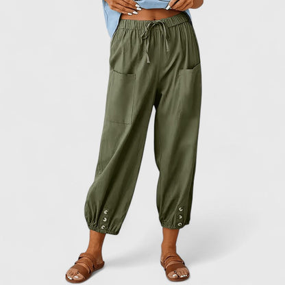 Cropped broek dames met taps toelopende pijpen en knoopdetail bij de enkel
