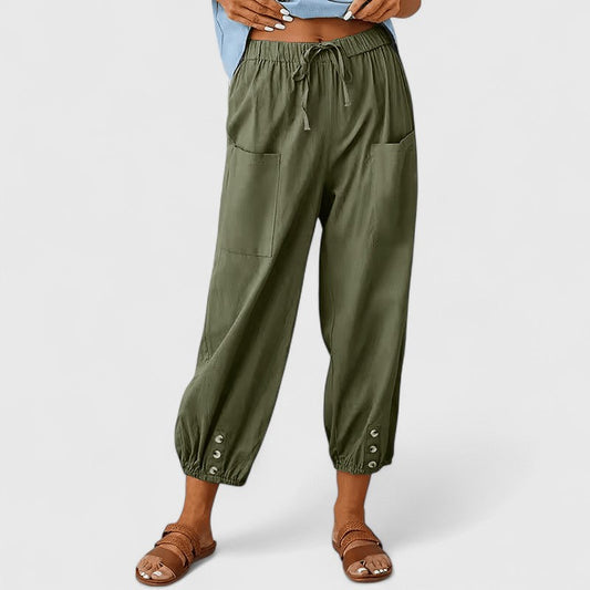 Cropped broek dames met taps toelopende pijpen en knoopdetail bij de enkel