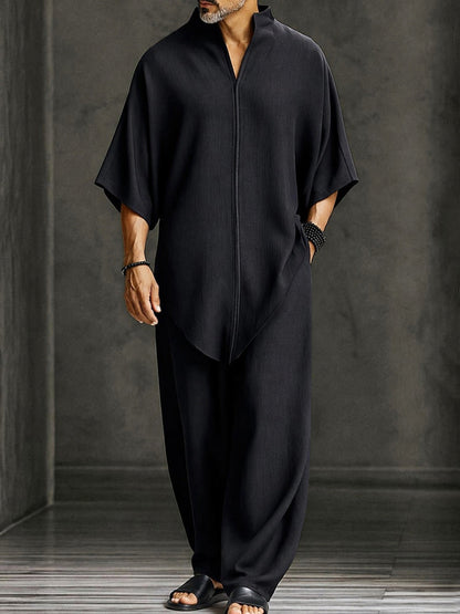 Tweedelige set heren met asymmetrische top en wijde broek