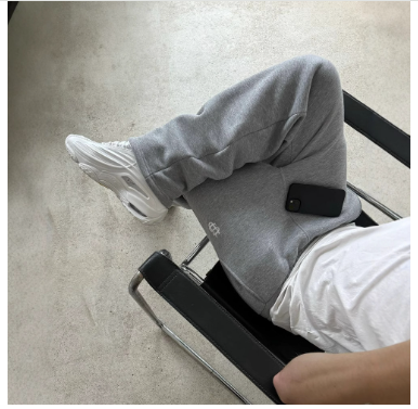 Flared joggingbroek met enkelritsen en elastische tailleband